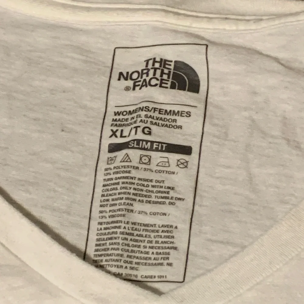 The North Face Women’s White V-Neck Tee with Aqua Graphic - Picture 4 of 10